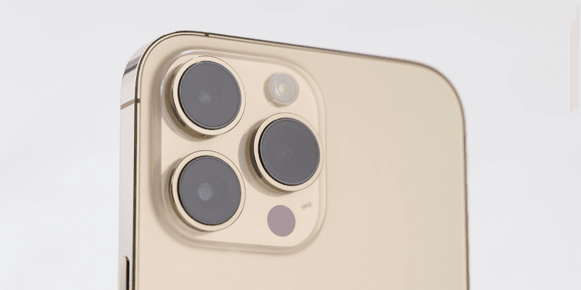 Close-up of a smartphone's rear camera module featuring three lenses and a flash