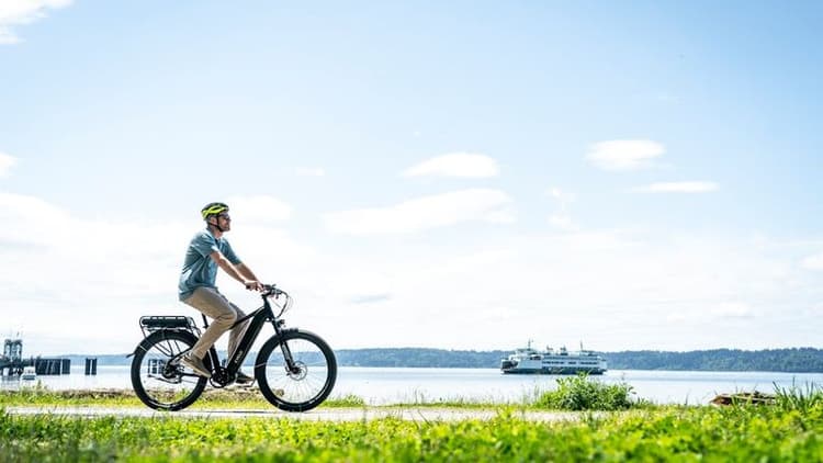Free Photo Of A Man Riding An Electric Bike On A Grassy Field