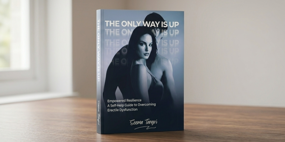 Book titled The Only Way Is Up displayed upright on a wooden table in a softly lit room.